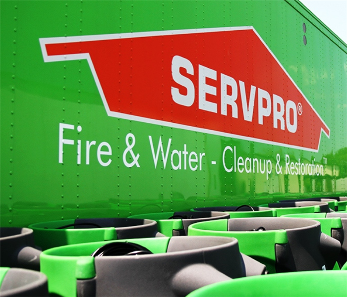 Photo of SERVPRO orange roof with storm equipment